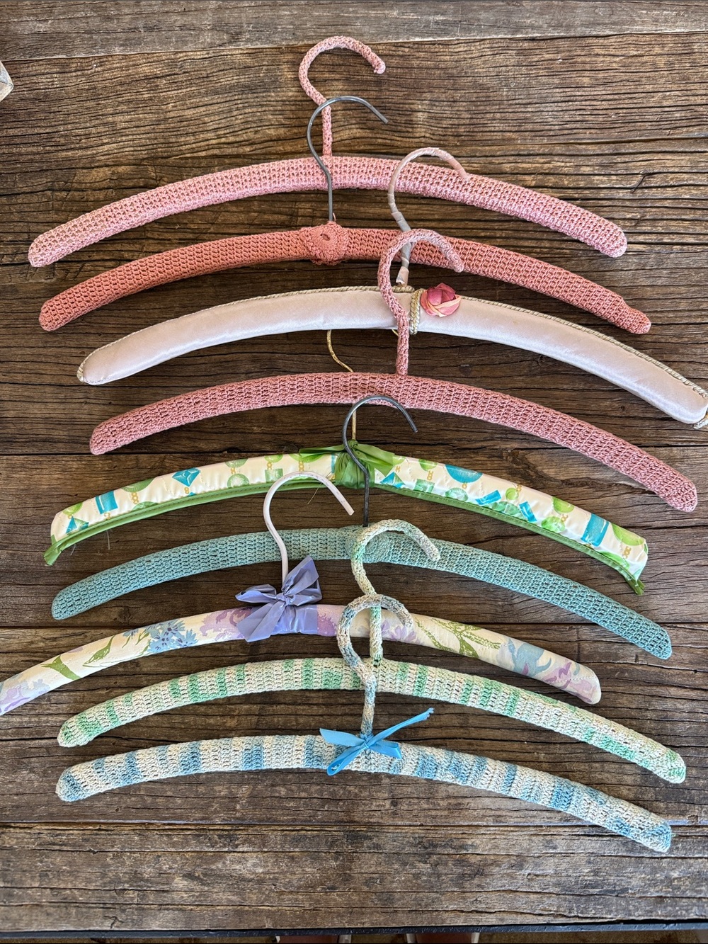 Vintage wooden hangers crocheted and fabric covered. Set of 9